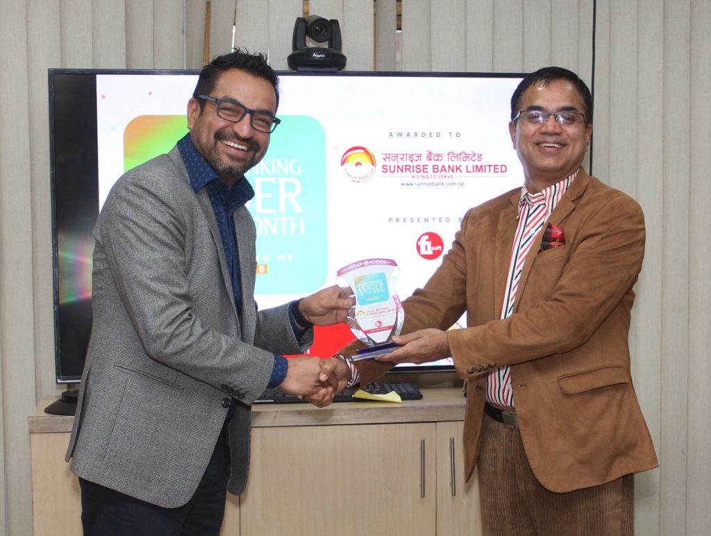 Sunrise Bank bags Mobile Banking Leader award Biswas-Dhakal-presents-award-to-Surise-Bank-CEO